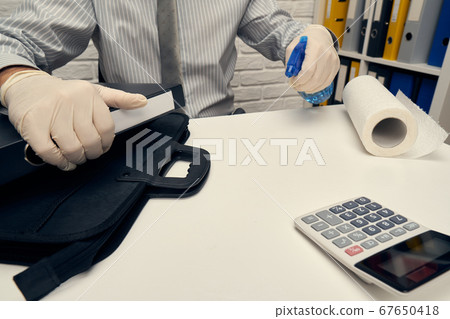 concept of cleaning or disinfecting the office 67650418
