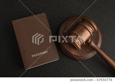 Passports and judge gavel on gray black Passports and judge gavel on gray black 67650778
