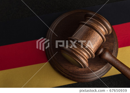 Judges hammer and flag of Germany. Law of Germany. 67650939
