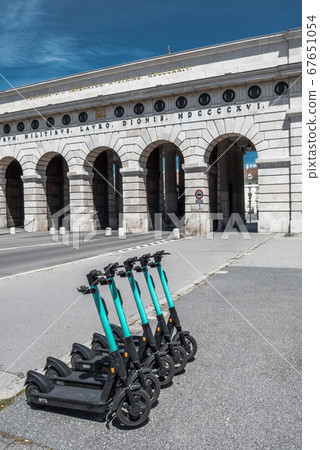 Rental Electric Scooters, e-scooter, Parked In Group In Front Of Historic Building In Vienna Austria Rental Electric Scooters, e-scooter, Parked In Group In Front Of Historic Building In Vienna Austria 67651054