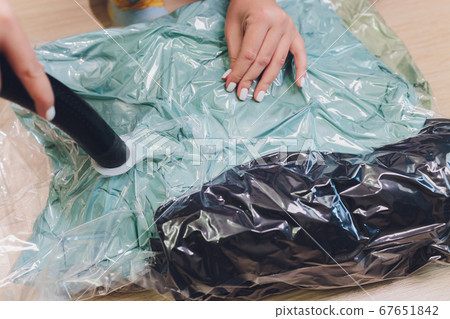 Space saver saving seal bag sucking air out , vacuum clothing storage compressed package. 67651842