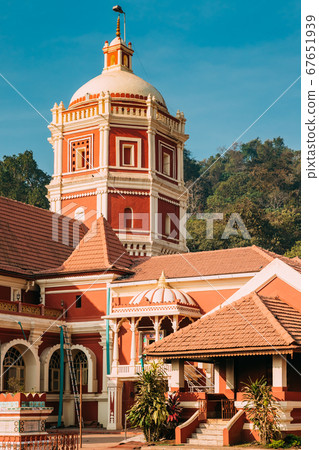Kavlem, Phonda, Goa, India. Shree Shantadurga Mandir, Kavlem Temple. Famous Landmark And Popular Destination. White Lamp Tower. Shantadurga Devi Kavlem, Phonda, Goa, India. Shree Shantadurga Mandir, Kavlem Temple. Famous Landmark And Popular Destination. White Lamp Tower. Shantadurga Devi 67651939