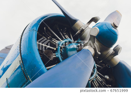 Close up view of a vintage propeller passenger and cargo airplane. Close up view of a vintage propeller passenger and cargo airplane. 67651999