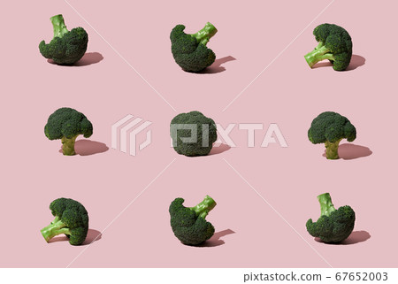 Green Broccoli head on pink background Green Broccoli head on pink background 67652003