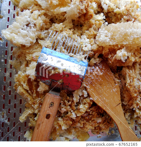 wax honeycomb from a bee hive filled with golden wax honeycomb from a bee hive filled with golden 67652165
