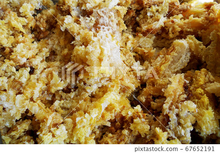 wax honeycomb from a bee hive filled with golden 67652191