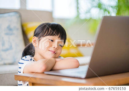 Girl learning online at home Girl learning online at home 67659150