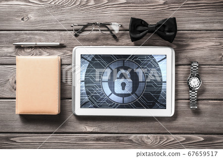 Gentleman kit of tablet watch glasses and notebook on wooden table 67659517