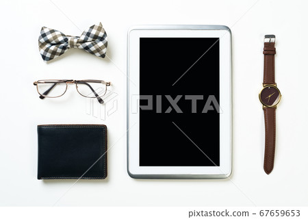 Gentleman kit of tablet watch glasses bow tie and notebook on wooden table 67659653