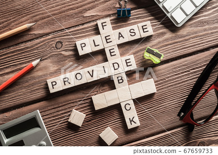 Conceptual media keywords on table with elements of game making crossword Conceptual media keywords on table with elements of game making crossword 67659733