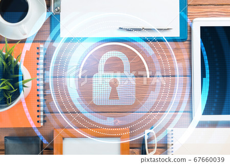 Business workplace with tablet pc and security concept on screen Business workplace with tablet pc and security concept on screen 67660039
