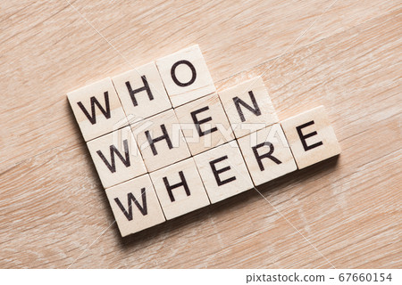Conceptual business keywords on table with elements of game making crossword 67660154