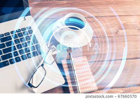 Business workplace with laptop coffee cup and security concept o Business workplace with laptop coffee cup and security concept o 67660370