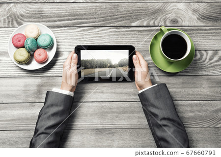 Businesswoman having coffee break Businesswoman having coffee break 67660791