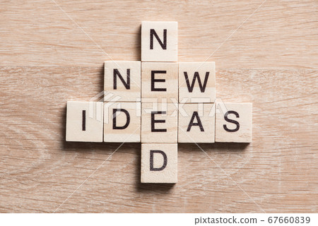 Conceptual business keywords on table with elements of game making crossword 67660839