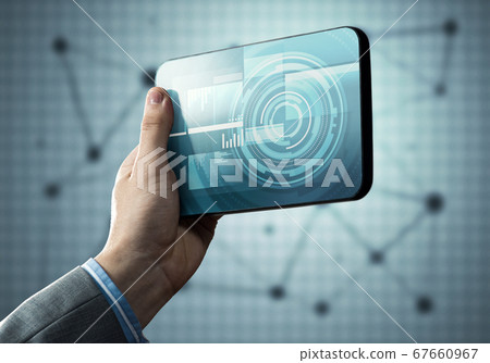 Media technology concept presented by businessman holding tablet with graphs and diagrams Media technology concept presented by businessman holding tablet with graphs and diagrams 67660967