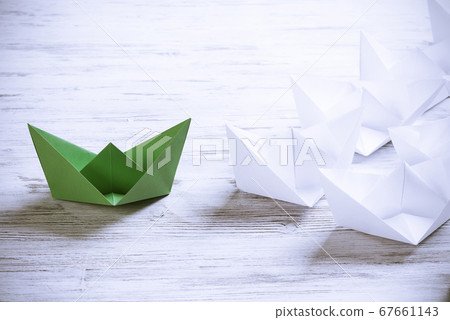 Business leadership concept with white and color paper boats on 67661143