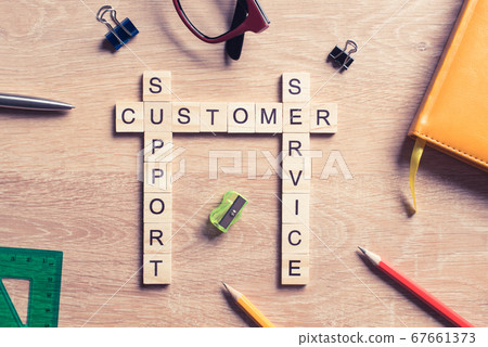 Conceptual media keywords on table with elements of game making crossword Conceptual media keywords on table with elements of game making crossword 67661373
