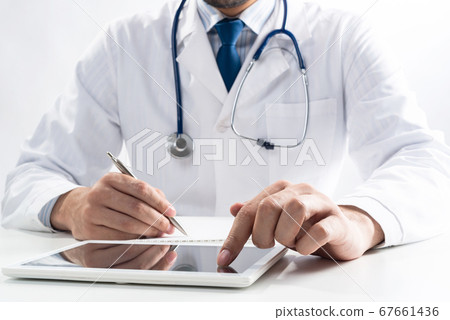 Close up of therapist hands using tablet computer Close up of therapist hands using tablet computer 67661436