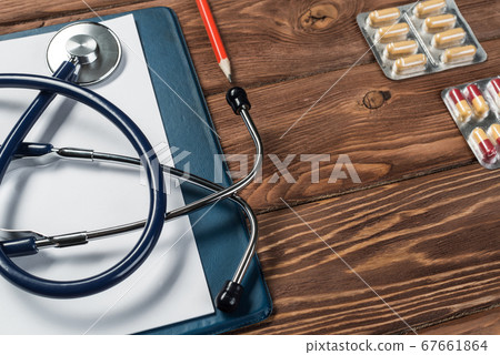 Desk of doctor with medicine things Desk of doctor with medicine things 67661864