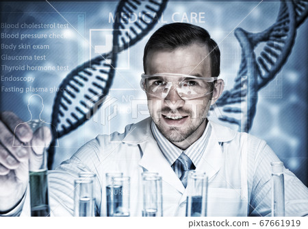 Young scientist mixing reagents in glass flask in clinical laboratory Young scientist mixing reagents in glass flask in clinical laboratory 67661919