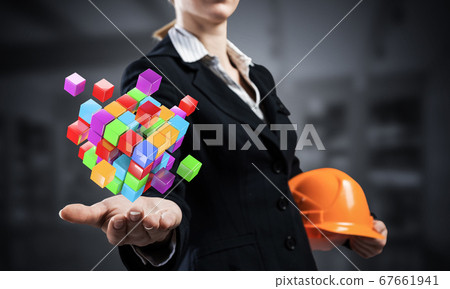 Businesswoman holds in palm abstract 3d cube Businesswoman holds in palm abstract 3d cube 67661941