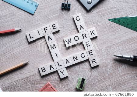 Words work life balance and family on table collected with wooden elements Words work life balance and family on table collected with wooden elements 67661990