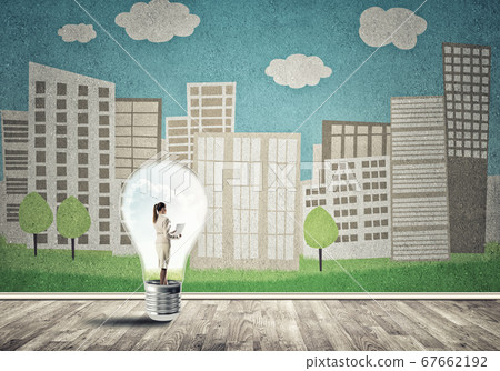 Businesswoman trapped in bulb Businesswoman trapped in bulb 67662192