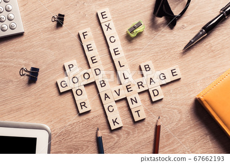Conceptual business keywords on table with elements of game making crossword Conceptual business keywords on table with elements of game making crossword 67662193