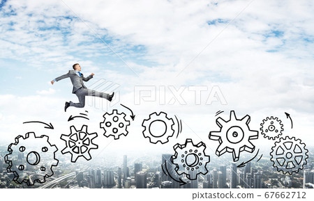 Businessman jumping high Businessman jumping high 67662712