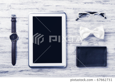 Gentleman kit of tablet watch glasses bow tie and notebook on wo Gentleman kit of tablet watch glasses bow tie and notebook on wo 67662731