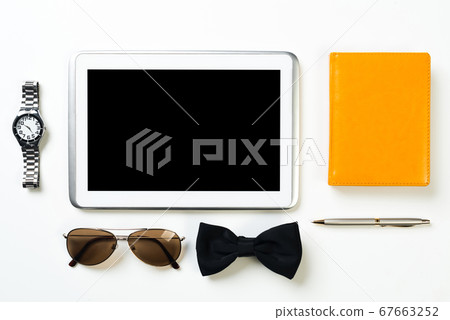 Gentleman kit of tablet watch glasses bow tie and notebook on wooden table Gentleman kit of tablet watch glasses bow tie and notebook on wooden table 67663252