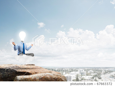 Businessman relaxing and waiting for inspiration Businessman relaxing and waiting for inspiration 67663372