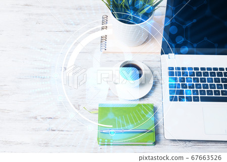 Business workplace with laptop coffee cup and security concept on screen 67663526