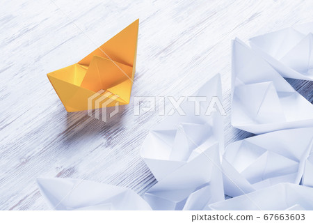 Business leadership concept with white and color paper boats on Business leadership concept with white and color paper boats on 67663603