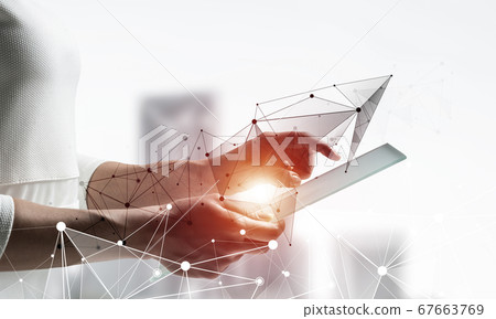 Businesswoman works with futuristic interface Businesswoman works with futuristic interface 67663769