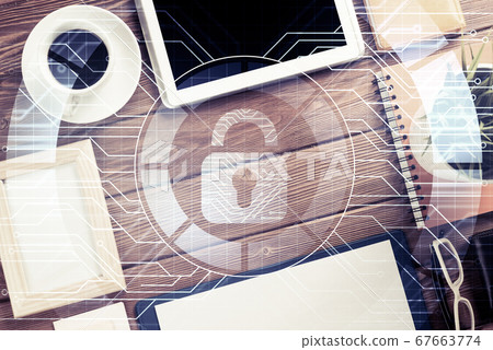 Business workplace with tablet pc and security concept on screen Business workplace with tablet pc and security concept on screen 67663774