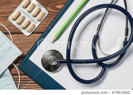 Desk of doctor with medicine things Desk of doctor with medicine things 67663960