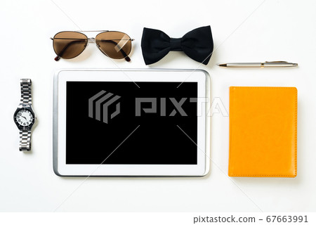 Gentleman kit of tablet watch glasses bow tie and notebook on wooden table Gentleman kit of tablet watch glasses bow tie and notebook on wooden table 67663991