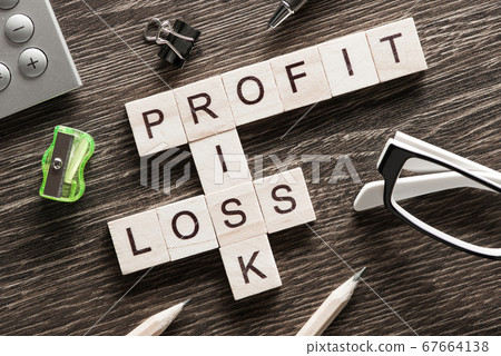 Conceptual business keywords on table with elements of game making crossword 67664138