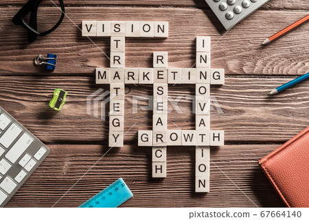 Conceptual business keywords on table with elements of game making crossword Conceptual business keywords on table with elements of game making crossword 67664140