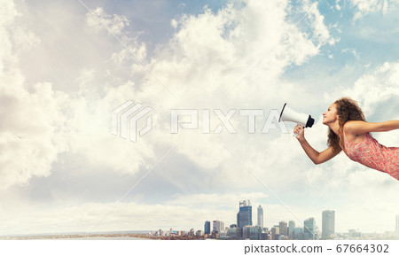Girl screaming in loudspeaker Girl screaming in loudspeaker 67664302