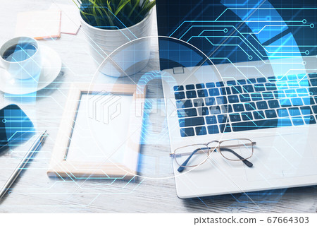 Business workplace with laptop coffee cup and security concept on screen Business workplace with laptop coffee cup and security concept on screen 67664303