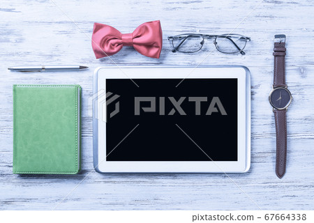 Gentleman kit of tablet watch glasses bow tie and notebook on wo Gentleman kit of tablet watch glasses bow tie and notebook on wo 67664338
