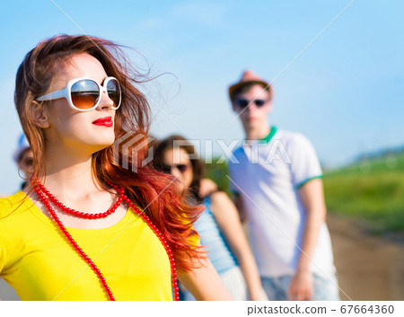 stylish young woman in sunglasses stylish young woman in sunglasses 67664360
