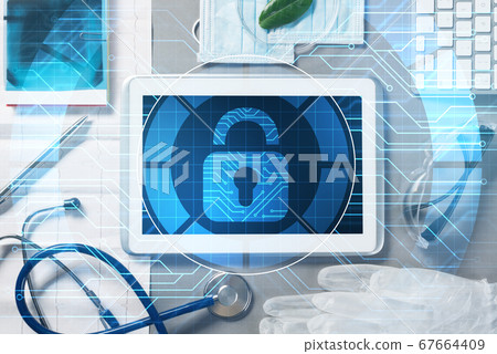 Top view of doctor workplace with tablet pc and medicine tools on wooden table Top view of doctor workplace with tablet pc and medicine tools on wooden table 67664409