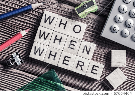 Conceptual keywords on wooden table with elements of game making crossword 67664464