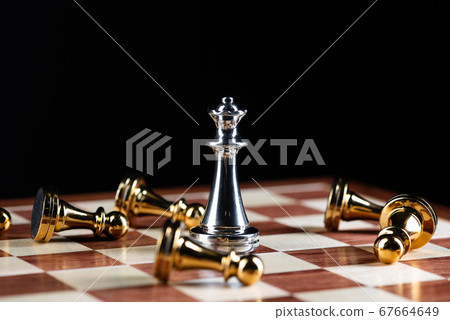 Silver queen chess defeats gold pawns on board. Silver queen chess defeats gold pawns on board. 67664649