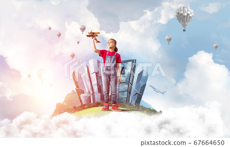 Concept of careless happy childhood with girl dreaming to become pilot Concept of careless happy childhood with girl dreaming to become pilot 67664650