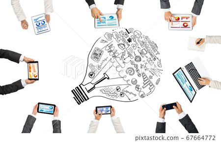 Top view of businesspeople sitting at table and using gadgets Top view of businesspeople sitting at table and using gadgets 67664772